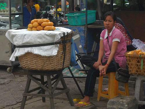 Young woman selling bread